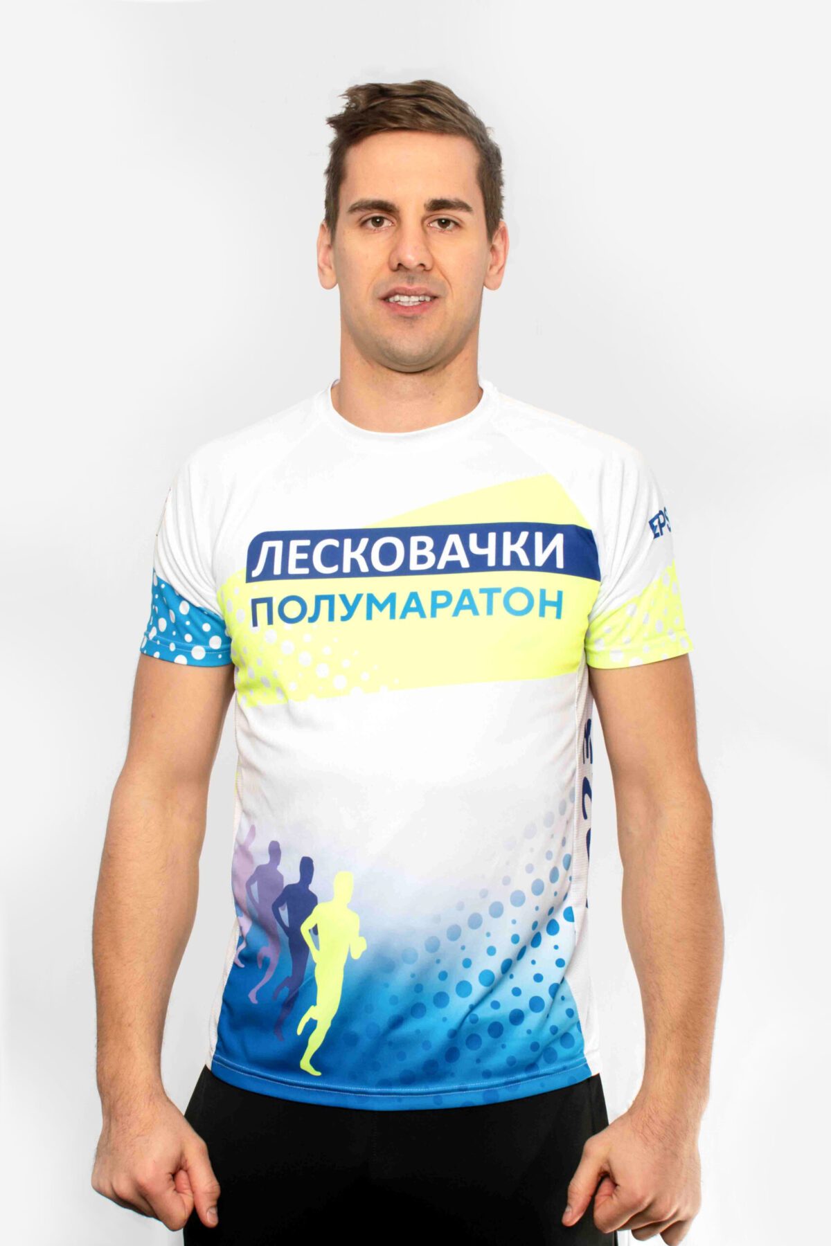 Man wearing an official marathon t-shirt (front of the t-shirt is shown)